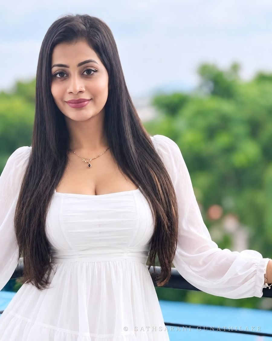 Sathsarani Gunathilake in a white dress outdoors